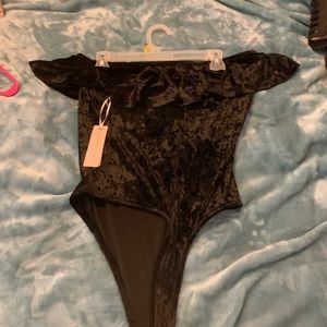 Around the shoulder black velvet one piece top.